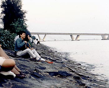 © Norbert Pousseur - Singapouriens en fin de journée au bord de mer 