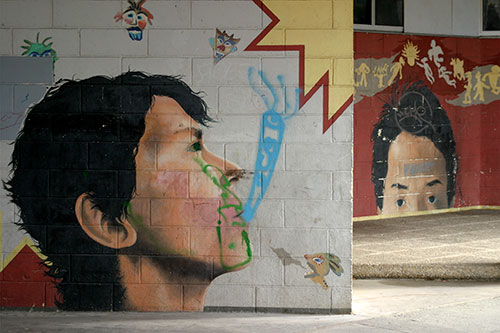 Fresque murale de deux têtes à Torcy - © Norbert Pousseur